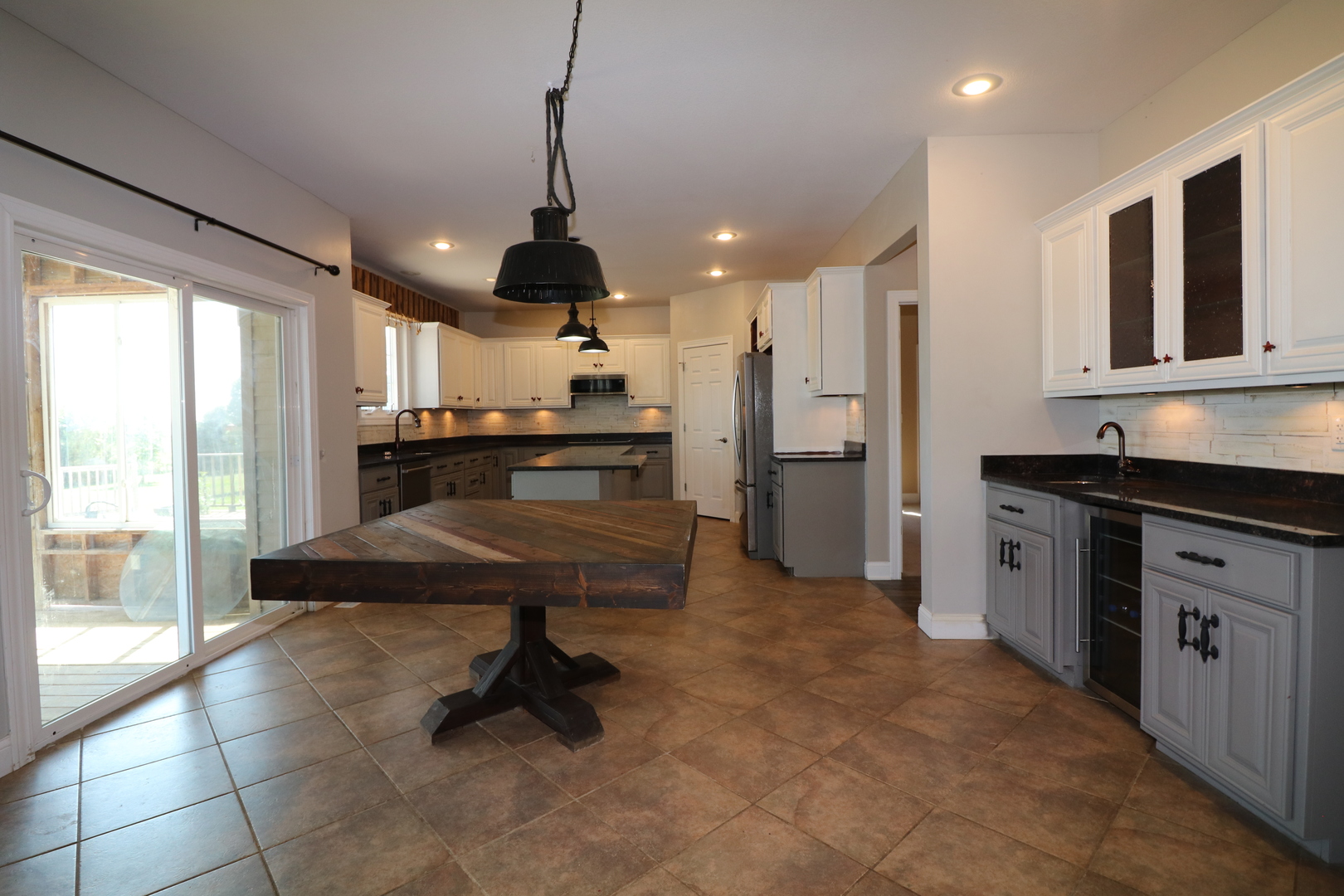 9358 Little Galilee Road Clinton, IL 61727 - Photo 13 of 40 a kitchen with stainless steel appliances granite countertop a sink a stove and a refrigerator