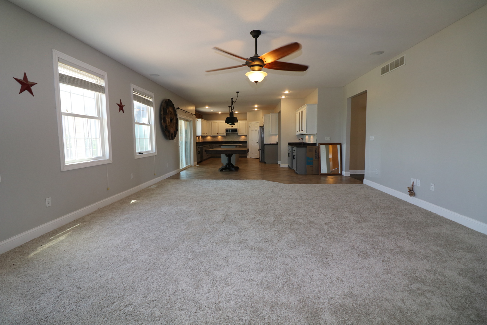 9358 Little Galilee Road Clinton, IL 61727 - Photo 15 of 40 a view of a livingroom with a ceiling fan and window