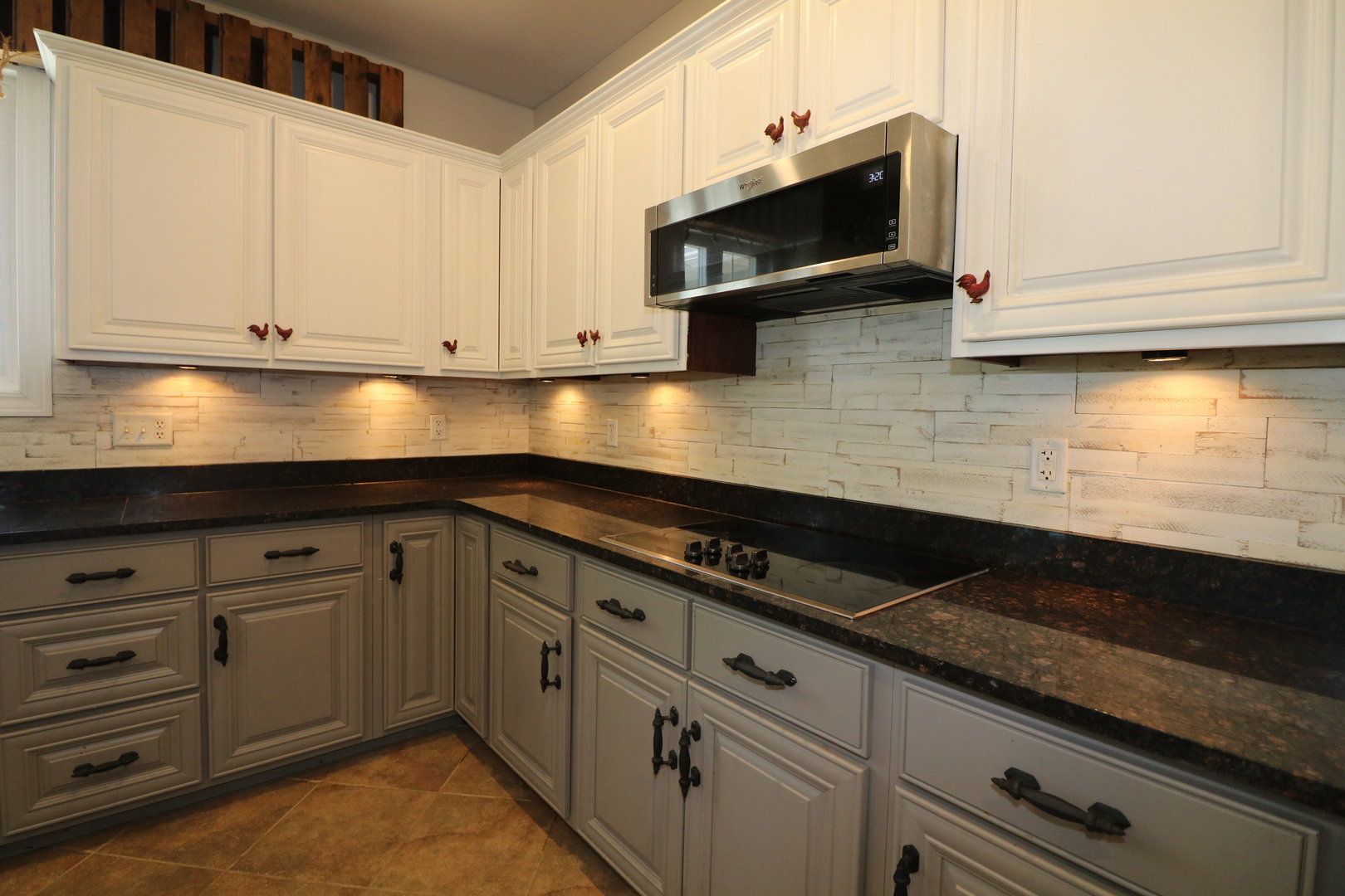 9358 Little Galilee Road Clinton, IL 61727 - Photo 19 of 40 a kitchen with granite countertop white cabinets and black appliances