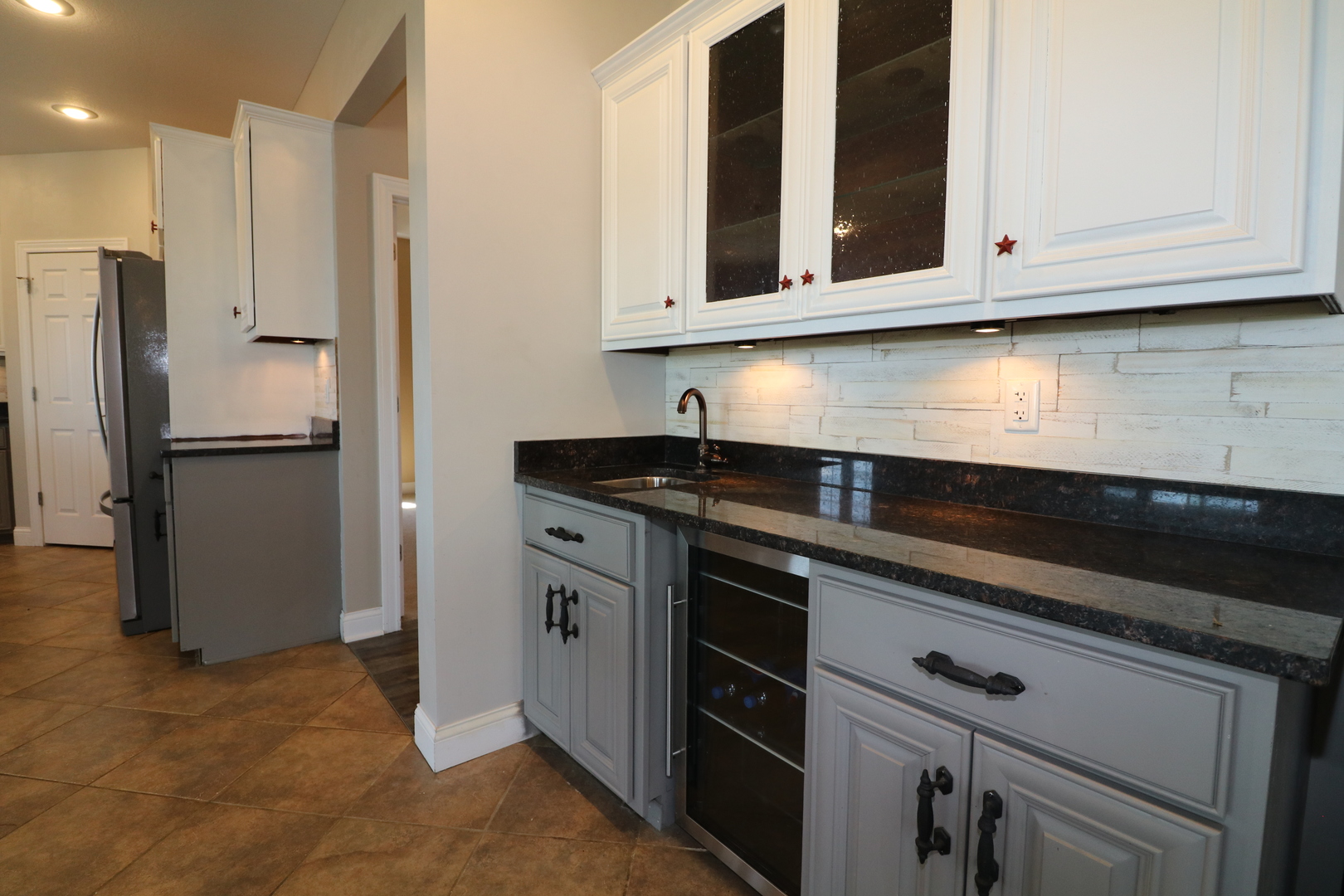 9358 Little Galilee Road Clinton, IL 61727 - Photo 21 of 40 a kitchen with stainless steel appliances granite countertop white cabinets and a refrigerator