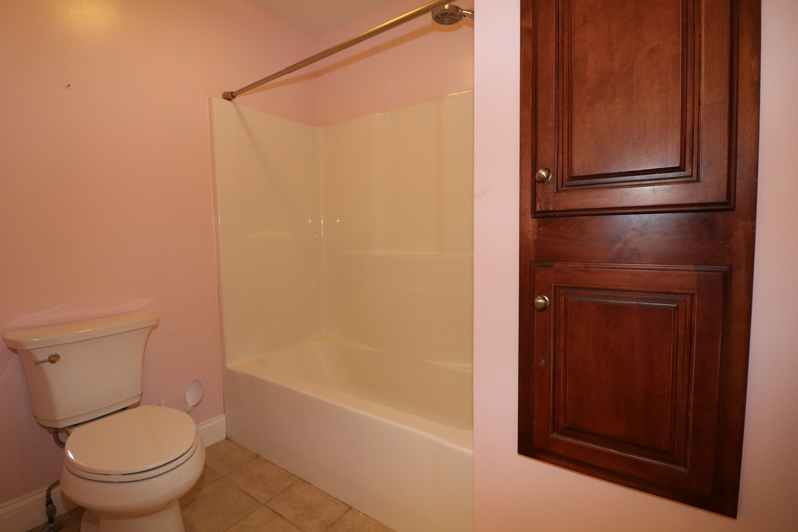 9358 Little Galilee Road Clinton, IL 61727 - Photo 25 of 40 a bathroom with a toilet and a bathtub