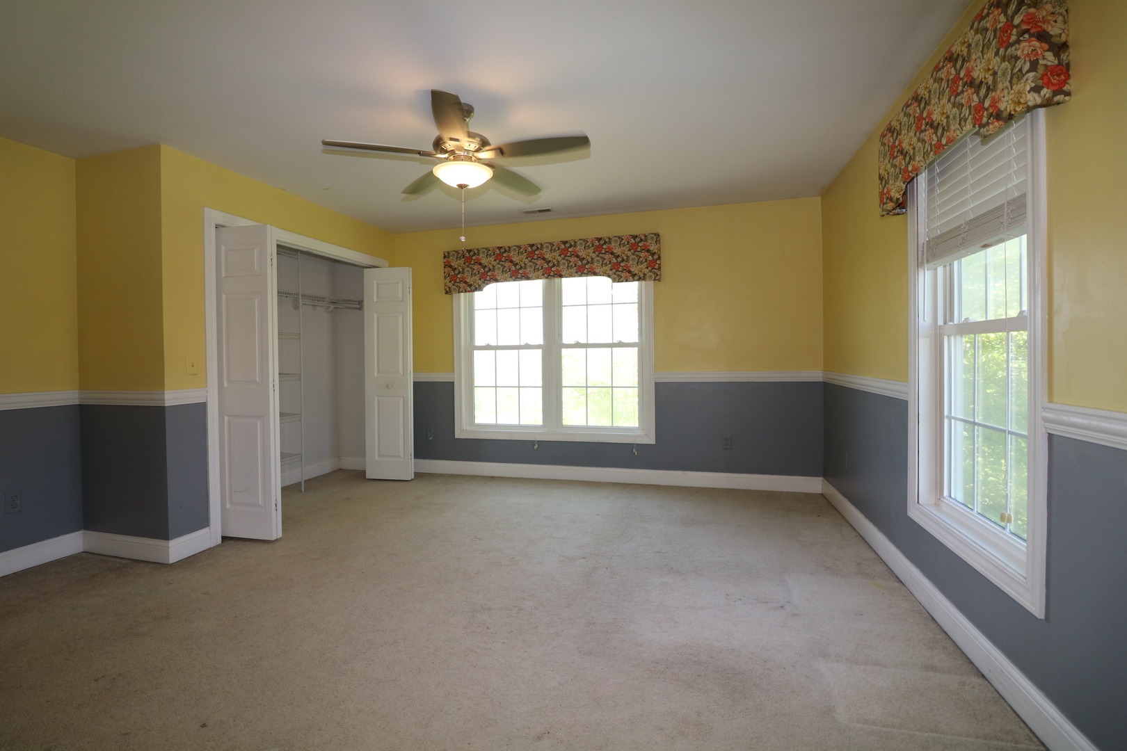 9358 Little Galilee Road Clinton, IL 61727 - Photo 26 of 40 a view of an empty room with chandelier fan and a window