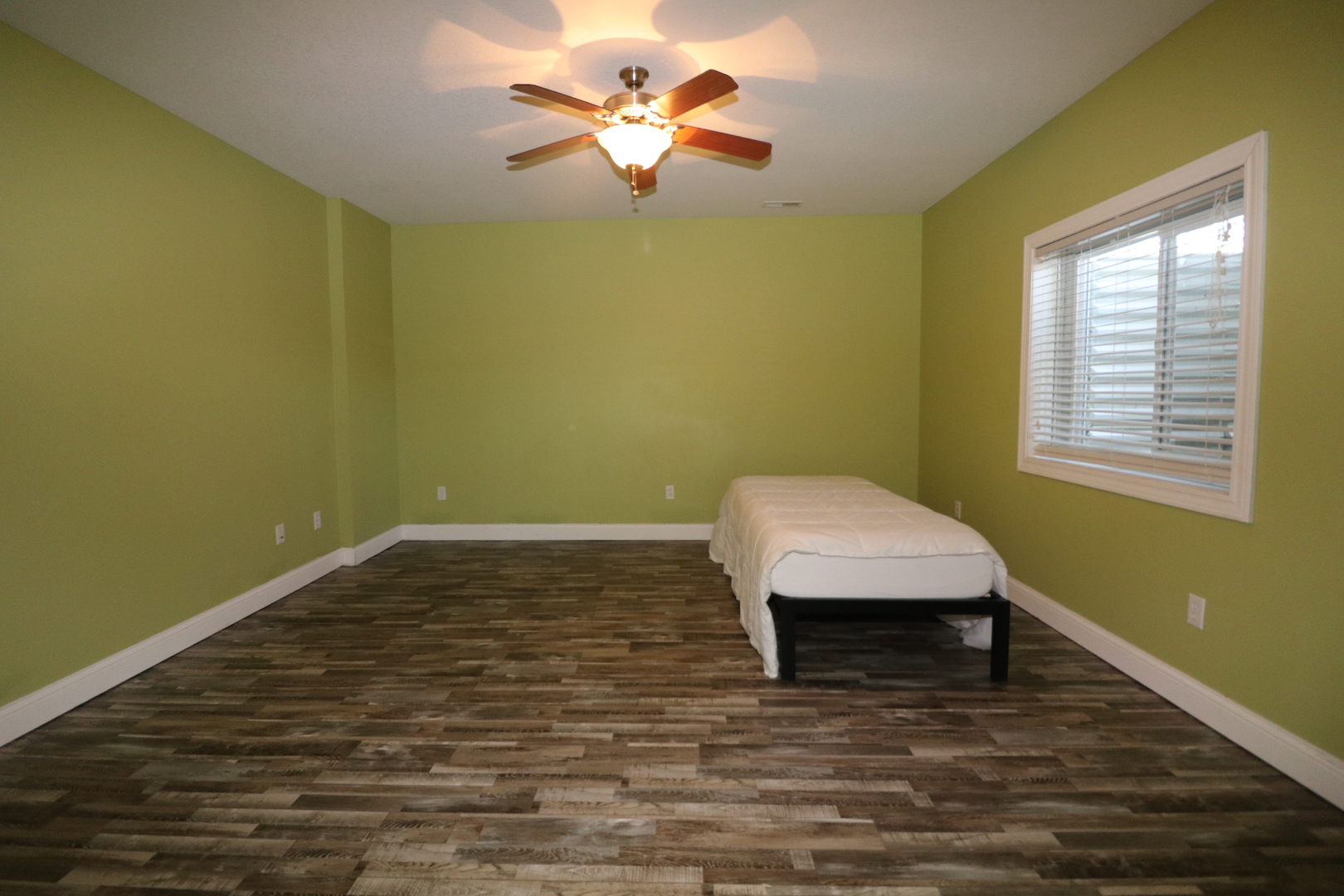 9358 Little Galilee Road Clinton, IL 61727 - Photo 36 of 40 a room with a bed and a chandelier