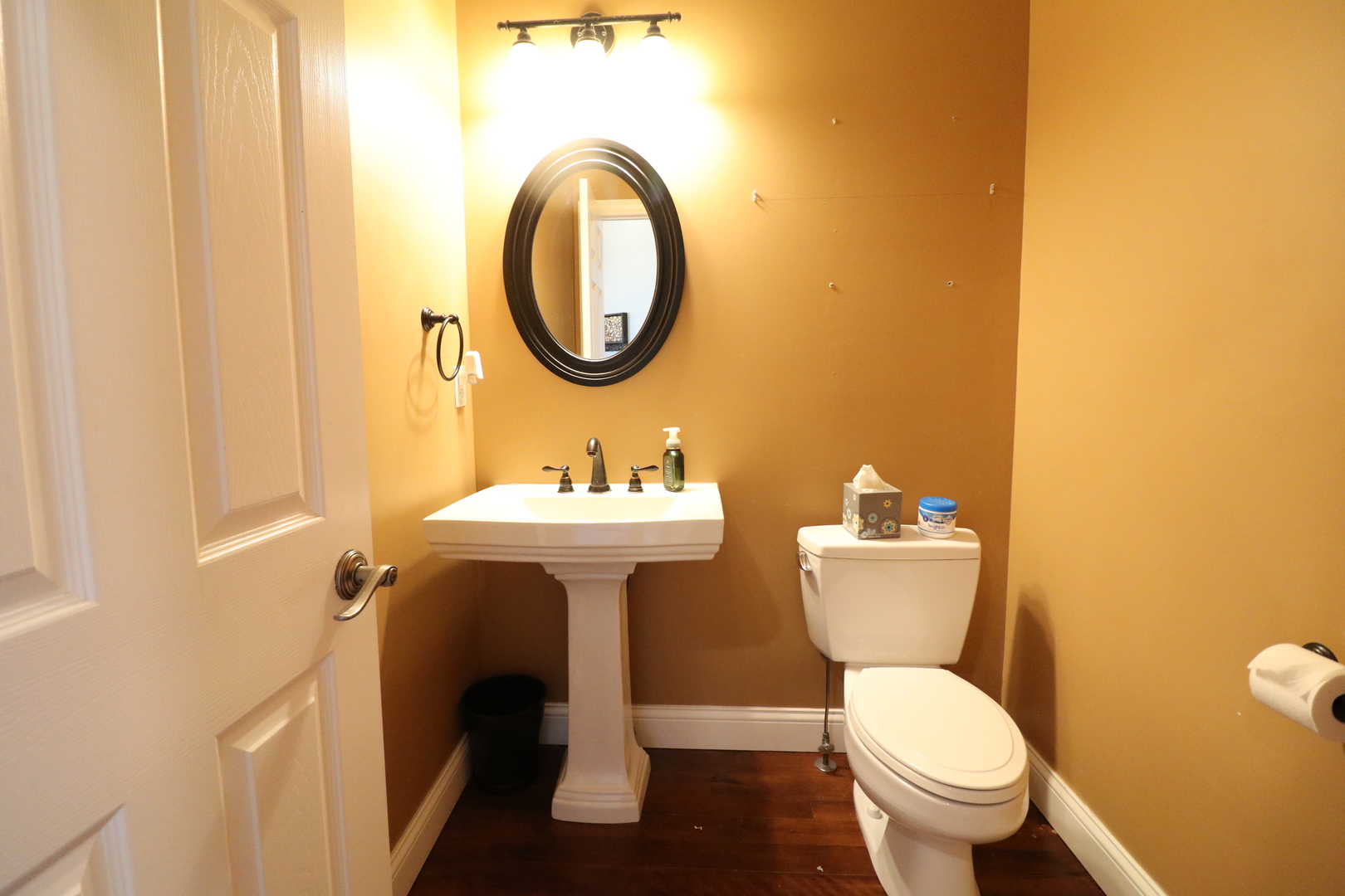 9358 Little Galilee Road Clinton, IL 61727 - Photo 5 of 40 a bathroom with a toilet sink and a mirror
