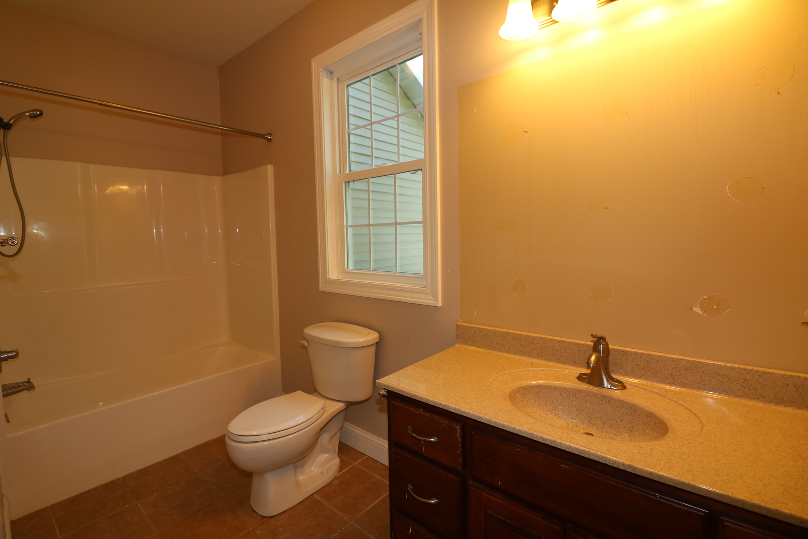 9358 Little Galilee Road Clinton, IL 61727 - Photo 10 of 40 a bathroom with a sink a toilet and a window