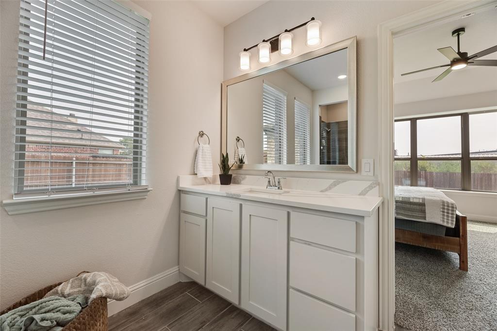 645 Mb Way South Pilot Point, TX 76258 - Photo 19 of 37 Primary bath features a spacious dual-sink vanity with quartz countertops, abundant storage, and plenty of natural light.