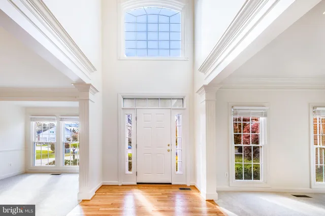 an aerial view of a house with a yard and outdoor seating