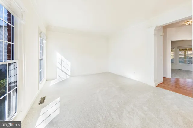 a kitchen with stainless steel appliances granite countertop a refrigerator a sink dishwasher a stove and a oven with wooden floor