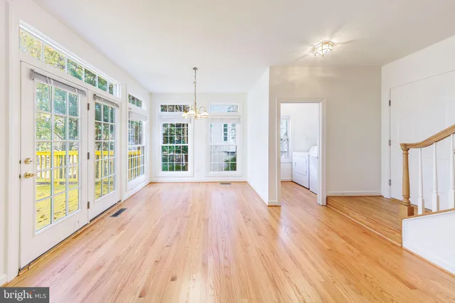 a view of empty room with windows