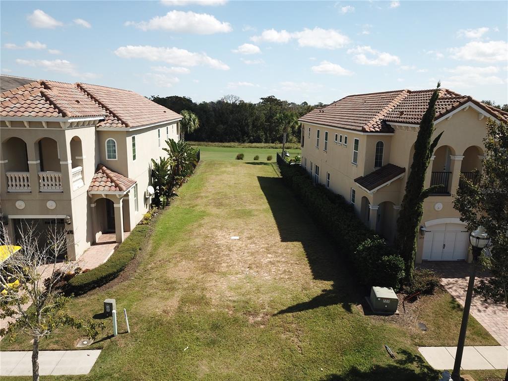 1149 Castle Pines Court Reunion, FL 34747 - Photo 2 of 16 a view of a house with many windows
