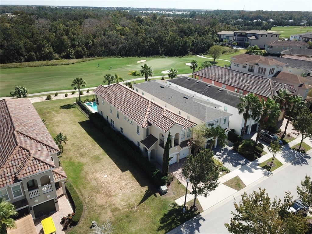 1149 Castle Pines Court Reunion, FL 34747 - Photo 3 of 16 a view of a houses with yard and mountain view