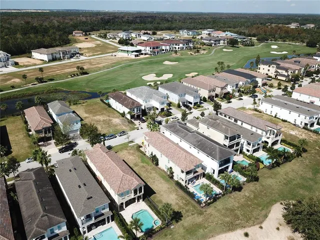an aerial view of a city with lots of residential buildings