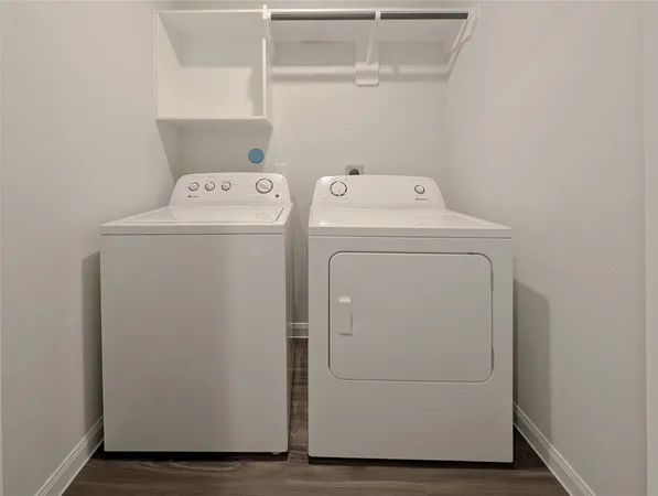 a utility room with dryer and washer