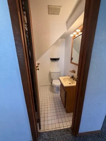 a bathroom with a sink and toilet