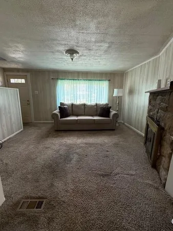 a living room with furniture and a rug
