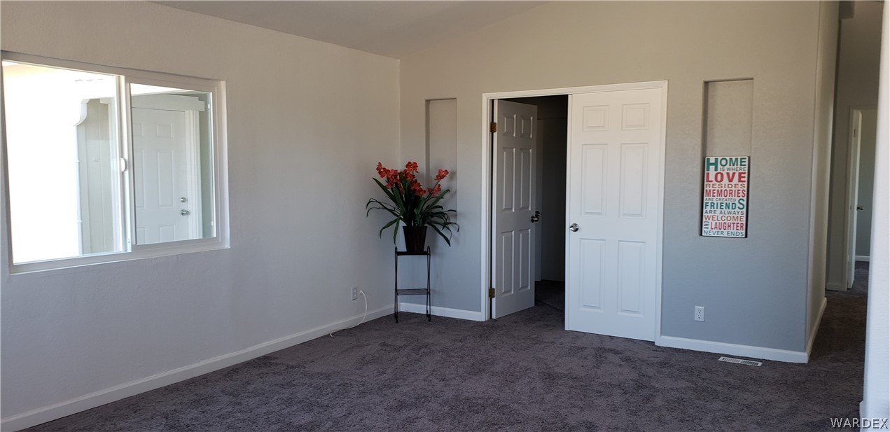 897 South Verde Road Golden Valley, AZ 86413 - Photo 5 of 49 Living Room. Doors lead to den/study