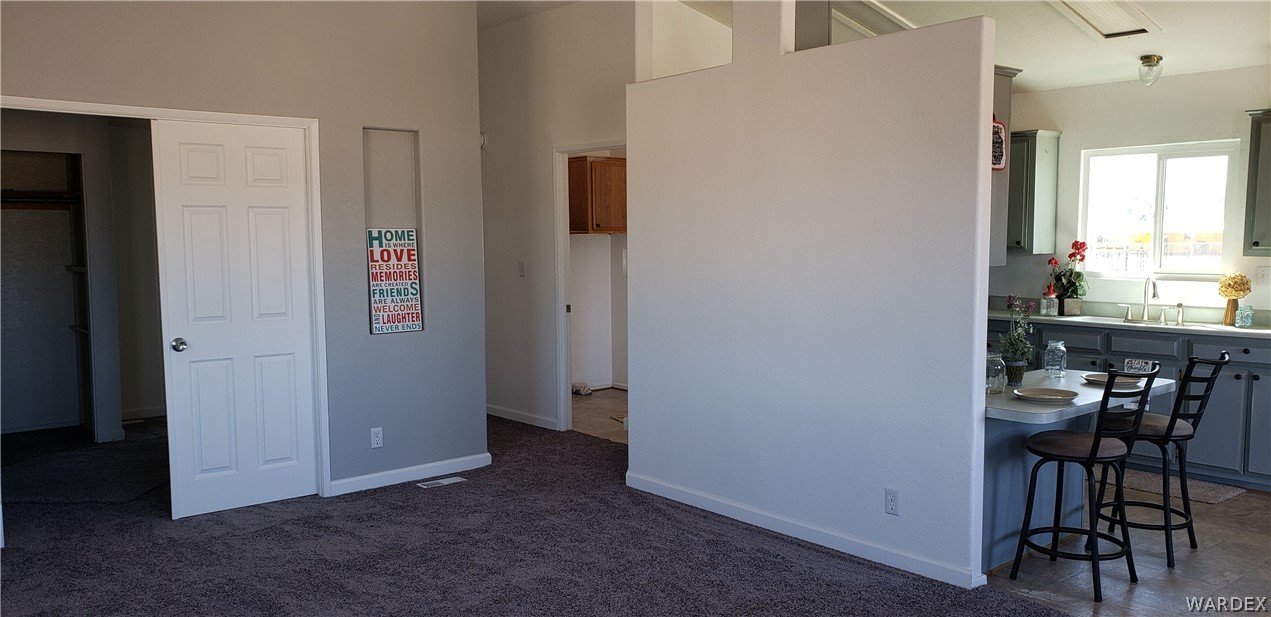 897 South Verde Road Golden Valley, AZ 86413 - Photo 6 of 49 In living room facing towards kitchen and hallway to bedrooms