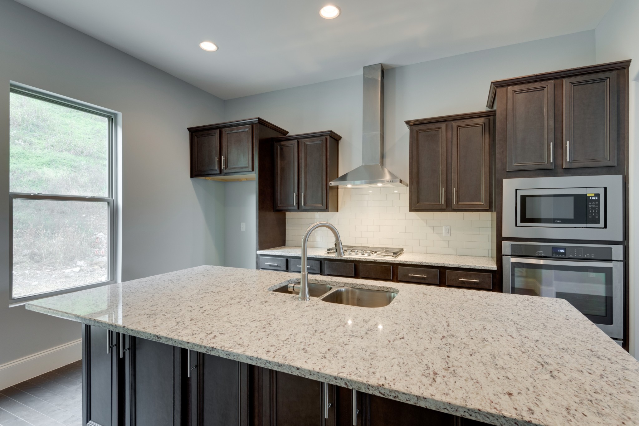 18 Hon Circle Murfreesboro, TN 37128 - Photo 11 of 30 a kitchen with granite countertop a sink refrigerator and microwave