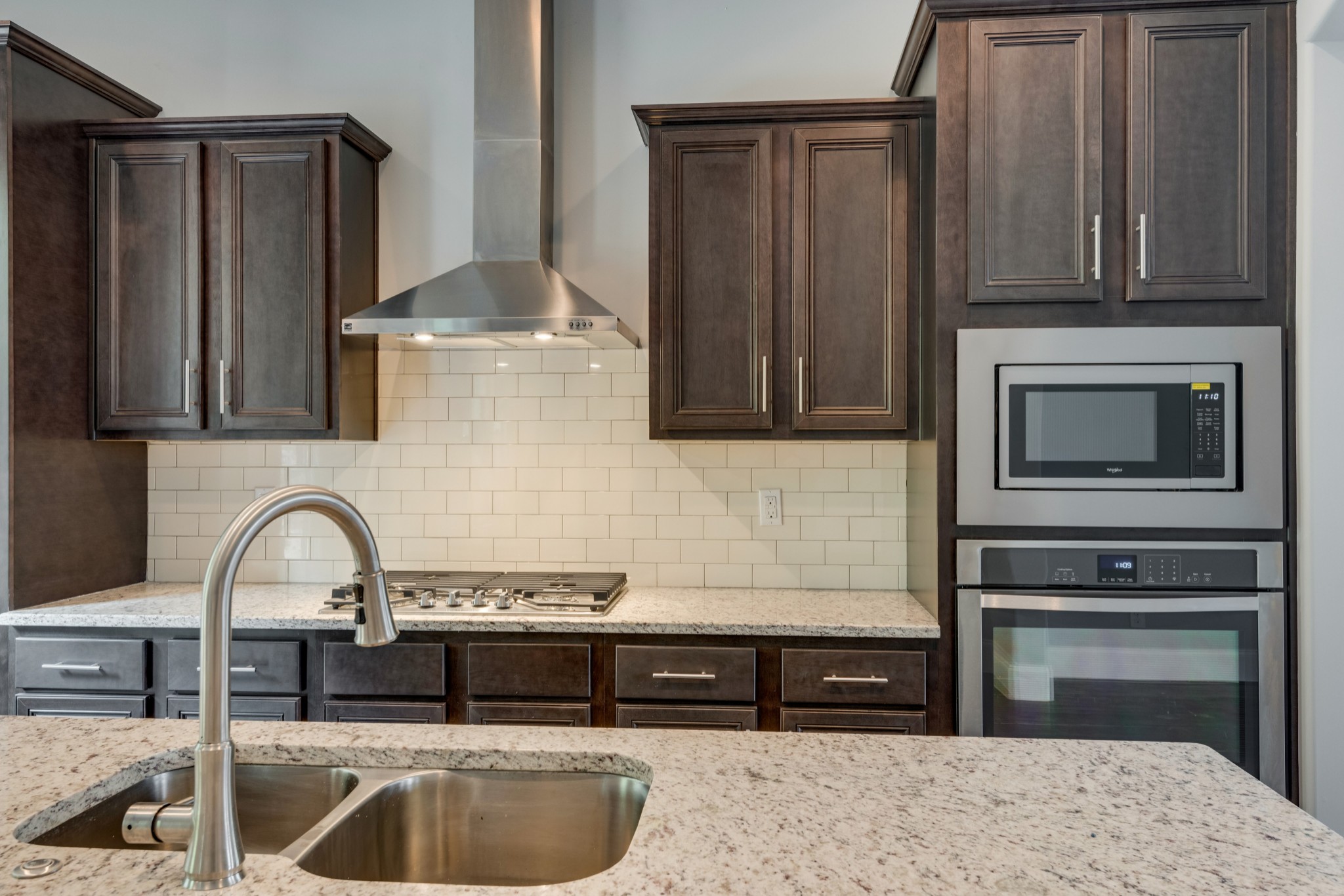 18 Hon Circle Murfreesboro, TN 37128 - Photo 13 of 30 a kitchen with granite countertop a stove and a refrigerator