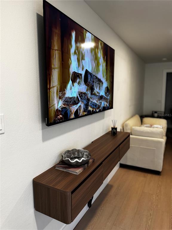 43420 Highway 27, Unit 414 Davenport, FL 33837 - Photo 16 of 41 a living room with furniture and a flat screen tv