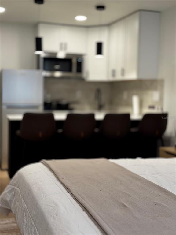 43420 Highway 27, Unit 414 Davenport, FL 33837 - Photo 17 of 41 a kitchen with a sink and cabinets