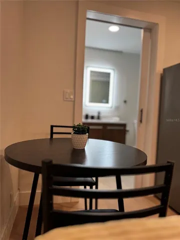 a bathroom with a toilet sink double vanity shower and mirror