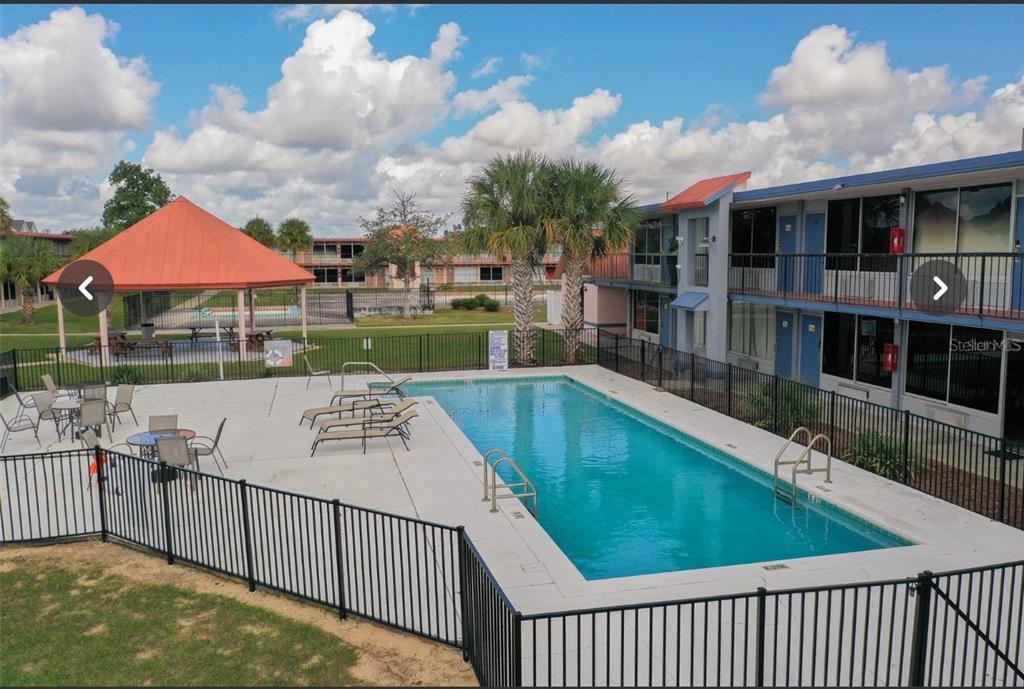 43420 Highway 27, Unit 414 Davenport, FL 33837 - Photo 2 of 41 a view of a swimming pool and deck