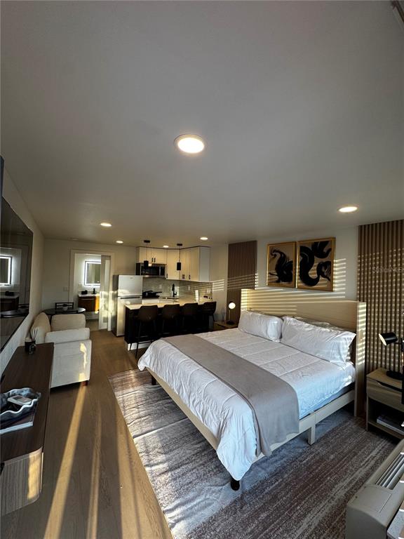 43420 Highway 27, Unit 414 Davenport, FL 33837 - Photo 33 of 41 a bedroom with a large bed and a couch