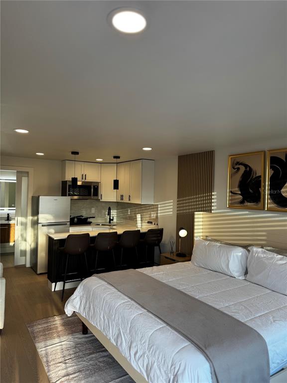 43420 Highway 27, Unit 414 Davenport, FL 33837 - Photo 34 of 41 a bedroom with a bed and view of kitchen