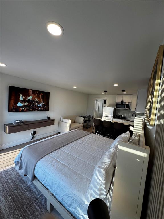 43420 Highway 27, Unit 414 Davenport, FL 33837 - Photo 36 of 41 a bedroom with furniture and a flat screen tv