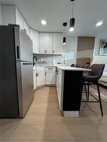 a front view of house with outdoor seating and yard