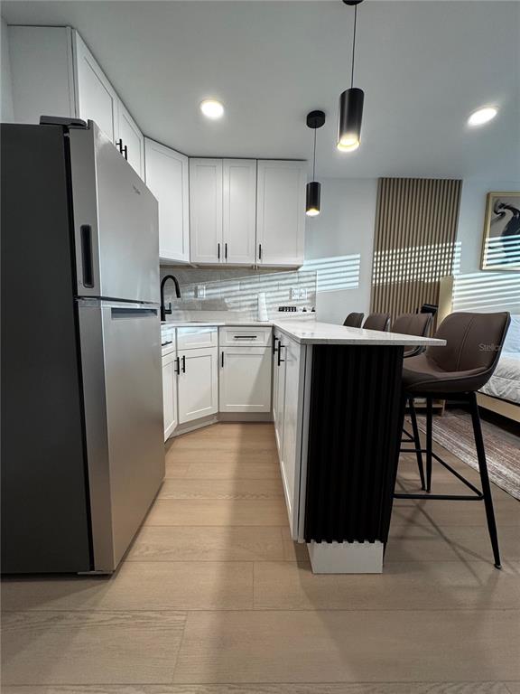 43420 Highway 27, Unit 414 Davenport, FL 33837 - Photo 38 of 41 a kitchen with stainless steel appliances granite countertop a refrigerator sink and cabinets