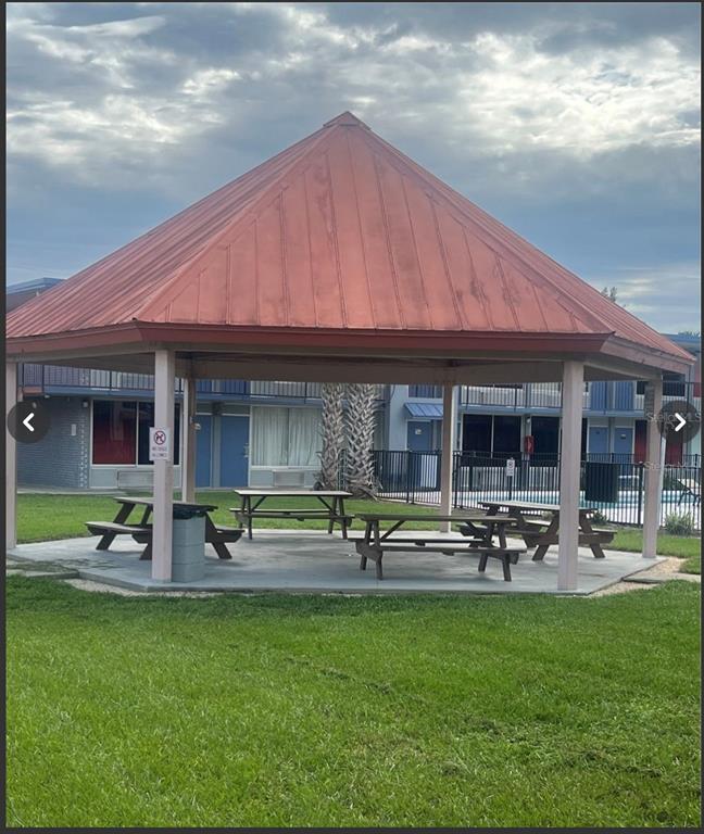43420 Highway 27, Unit 414 Davenport, FL 33837 - Photo 40 of 41 a front view of house with outdoor seating and yard