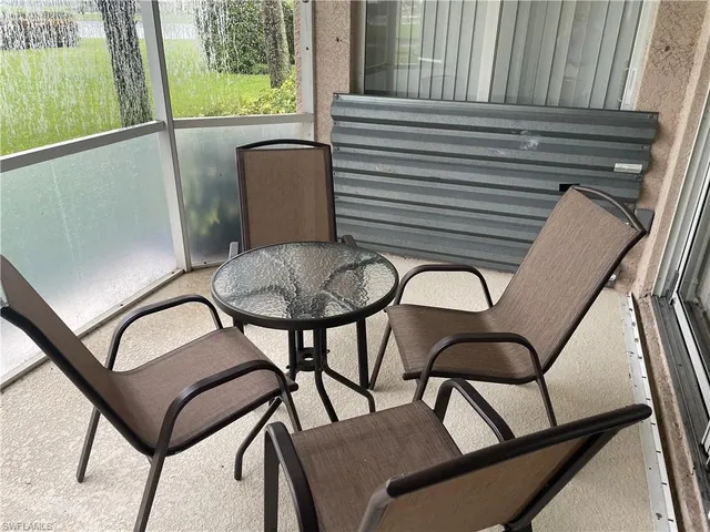 a view of a balcony furniture and outdoor seating