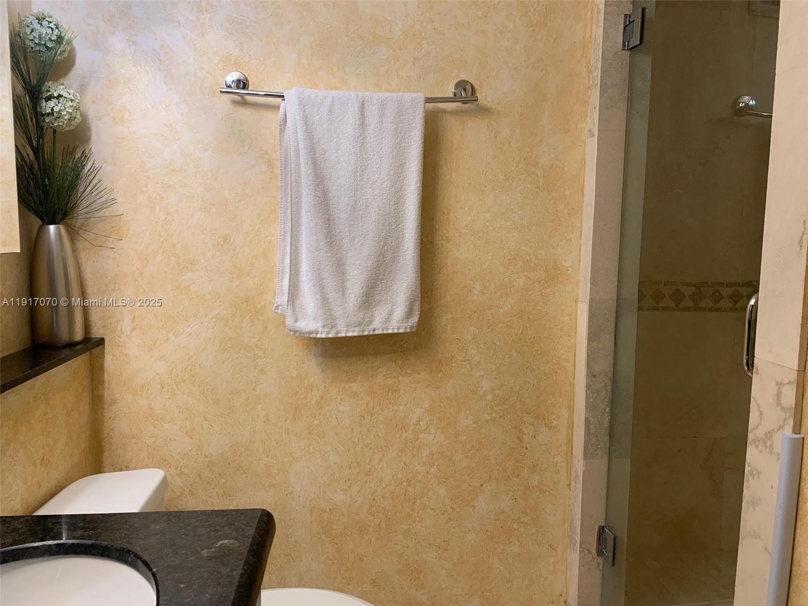100 Lincoln Road, Unit 1122 Miami Beach, FL 33139 - Photo 17 of 29 a view of bathroom with a shower and a mirror