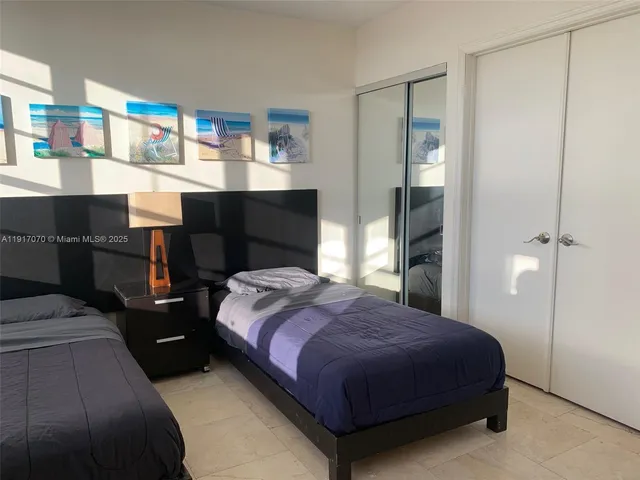 a bedroom with a bed and a cabinets