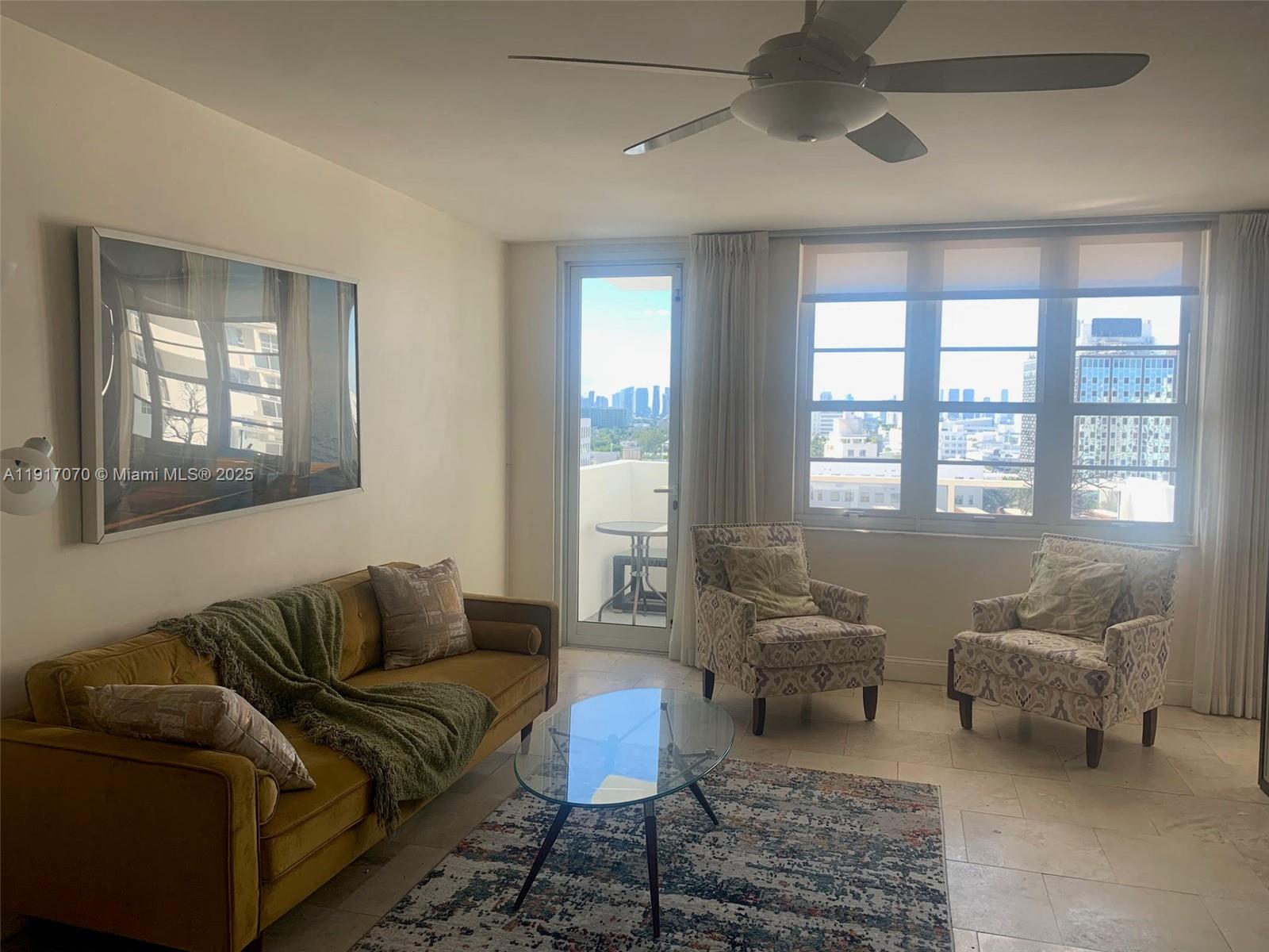 100 Lincoln Road, Unit 1122 Miami Beach, FL 33139 - Photo 7 of 29 a living room with furniture and a window
