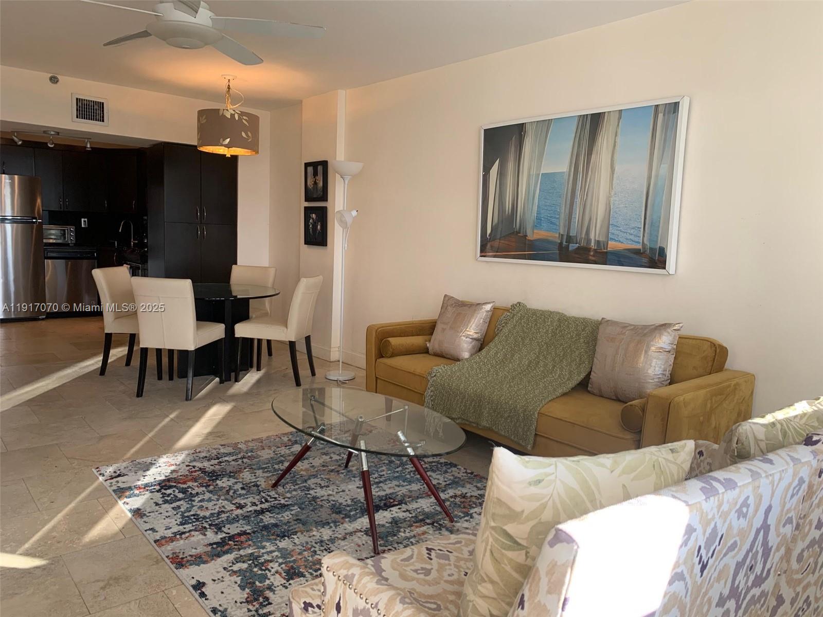 100 Lincoln Road, Unit 1122 Miami Beach, FL 33139 - Photo 8 of 29 a living room with furniture and a rug