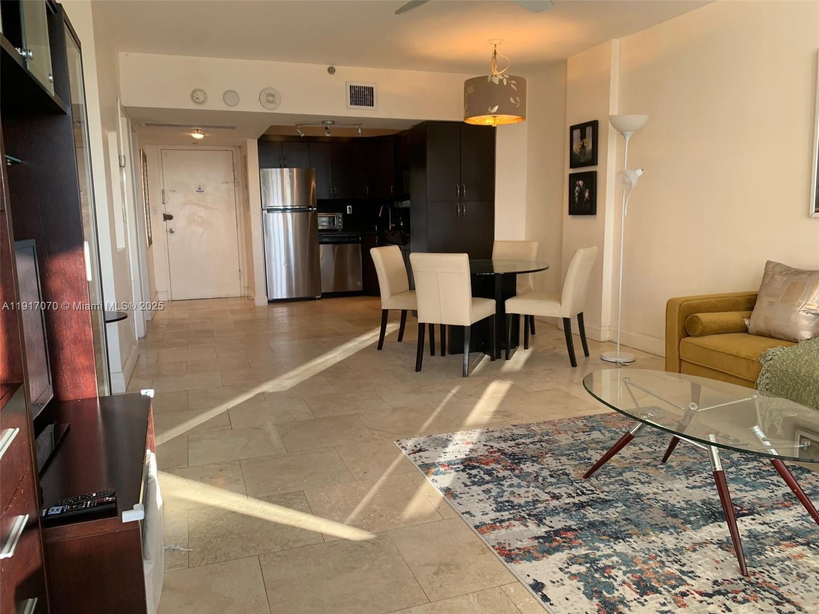 100 Lincoln Road, Unit 1122 Miami Beach, FL 33139 - Photo 9 of 29 a view of a dining room with furniture