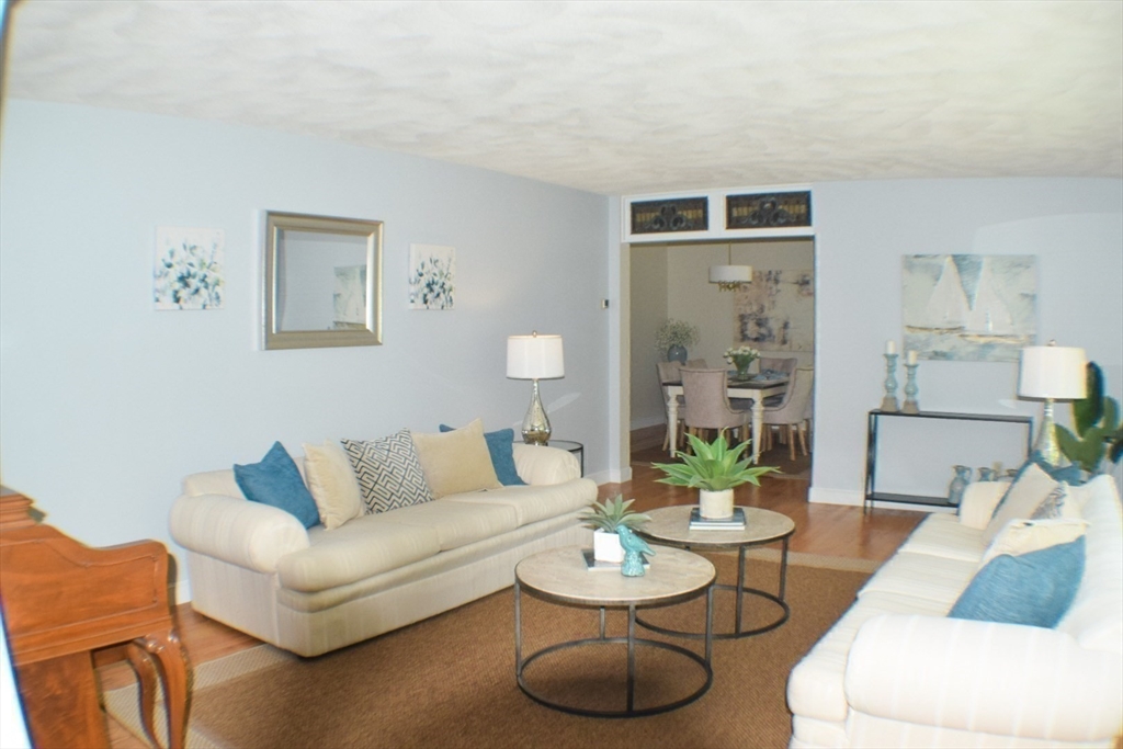 111 Bear Hill Road North Andover, MA 01845 - Photo 13 of 41 a living room with furniture and a wooden floor