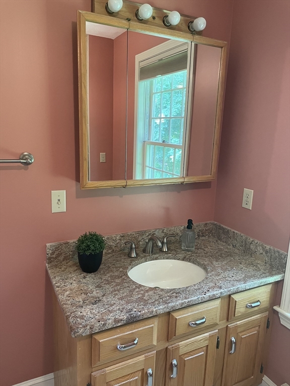 111 Bear Hill Road North Andover, MA 01845 - Photo 18 of 41 a bathroom with a granite countertop sink and a mirror