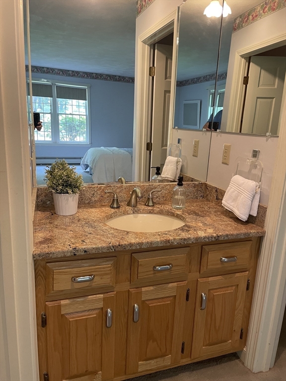 111 Bear Hill Road North Andover, MA 01845 - Photo 19 of 41 a bathroom with a granite countertop sink and a mirror
