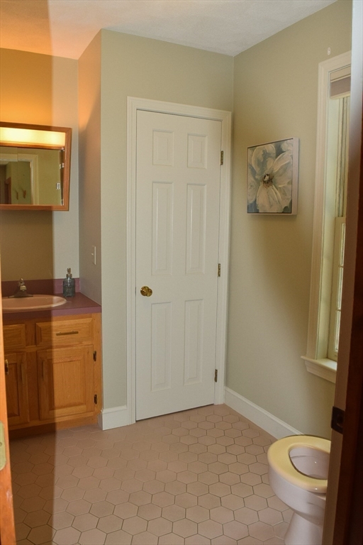 111 Bear Hill Road North Andover, MA 01845 - Photo 21 of 41 a bathroom with a granite countertop sink a toilet and shower