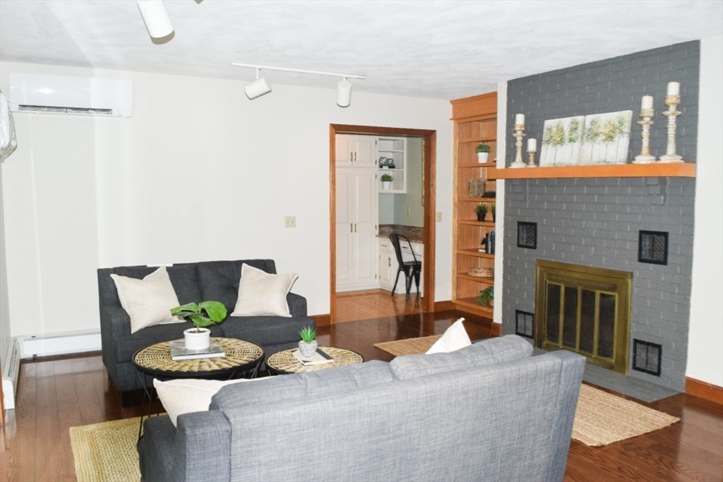 111 Bear Hill Road North Andover, MA 01845 - Photo 23 of 41 a living room with furniture and a fireplace