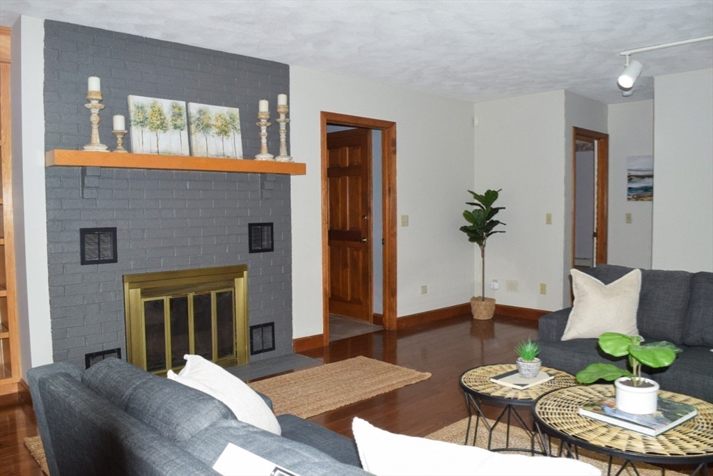 111 Bear Hill Road North Andover, MA 01845 - Photo 24 of 41 a living room with furniture and a fireplace