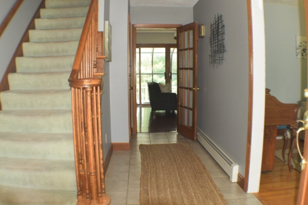 111 Bear Hill Road North Andover, MA 01845 - Photo 27 of 41 a view of a hallway with wooden floor and staircase