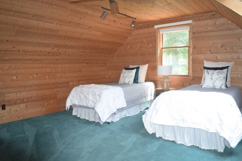 111 Bear Hill Road North Andover, MA 01845 - Photo 30 of 41 a bed sitting in a bedroom next to a window