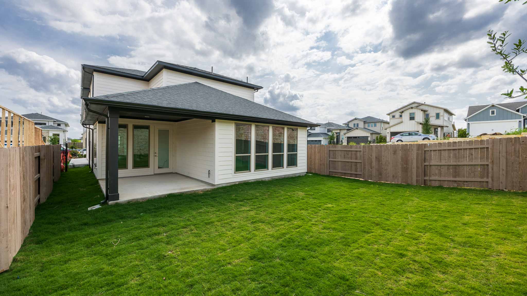 7002 Woodford Way Austin, TX 78744 - Photo 11 of 22 a view of a house with backyard and garden