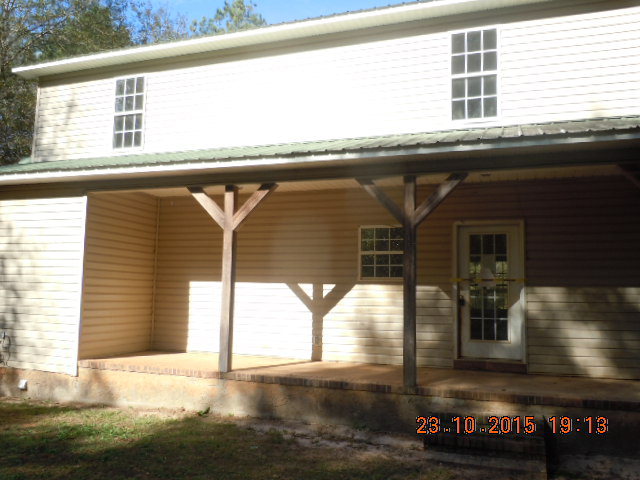 283 Stanley Cemetery Road Dublin, GA 31021 - Photo 3 of 9 a front view of a house with a garage