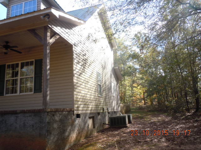 283 Stanley Cemetery Road Dublin, GA 31021 - Photo 8 of 9 a view of a backyard with large trees